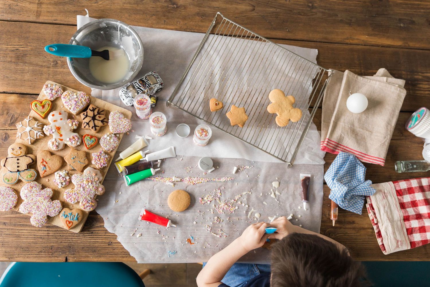 decorating gingerbread men with colourful icing
