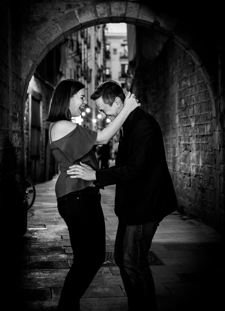 A couple rejoice after their engagement under the bridge