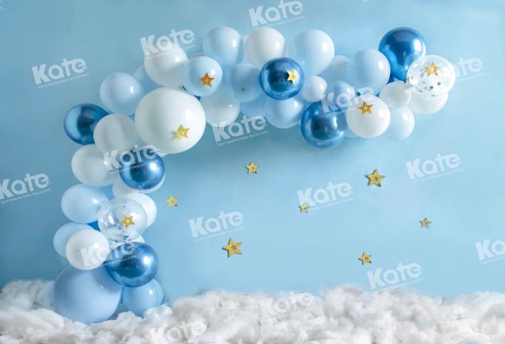 Blue and white balloon arch with gold stars creating a dreamy celestial party backdrop.