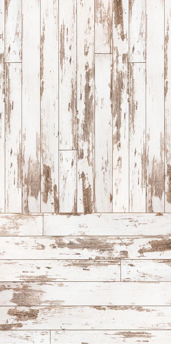 Distressed white wooden planks background with vintage weathered paint effect.