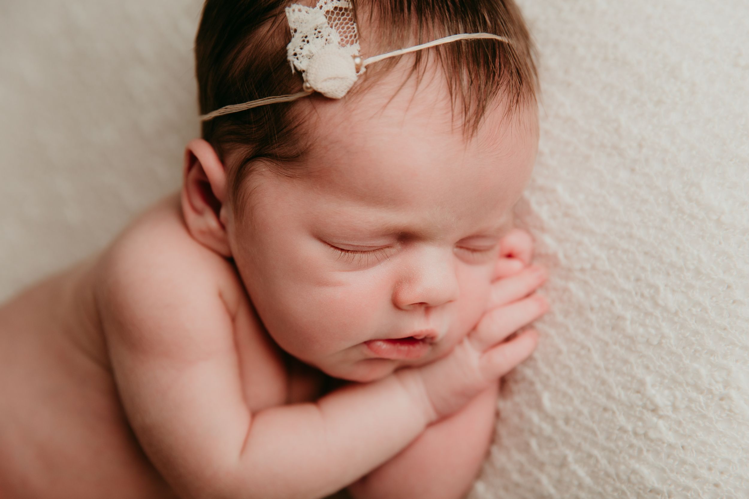 close up of newborn baby sleeping by kansas city newborn photographer