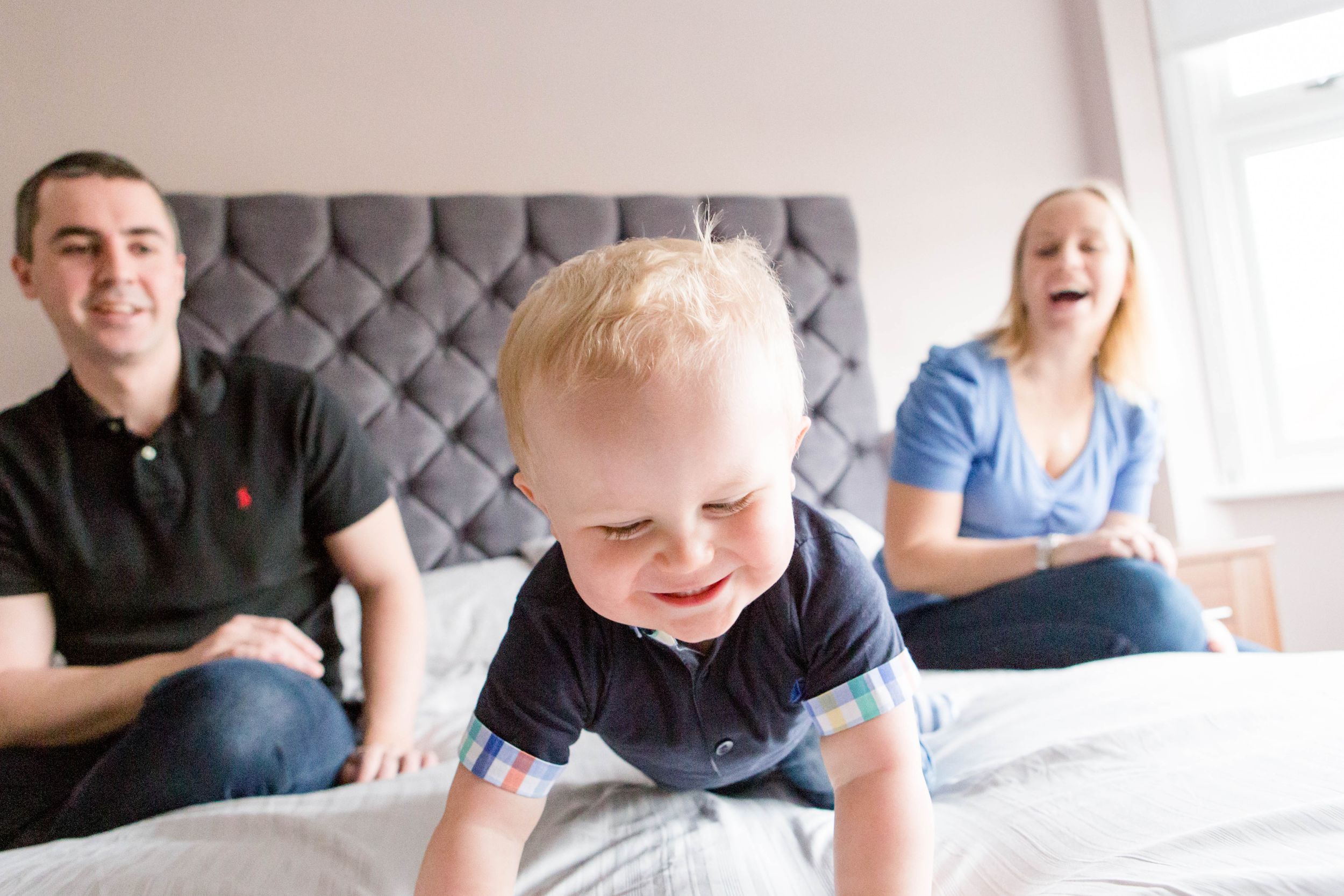 little blonde boy giggling