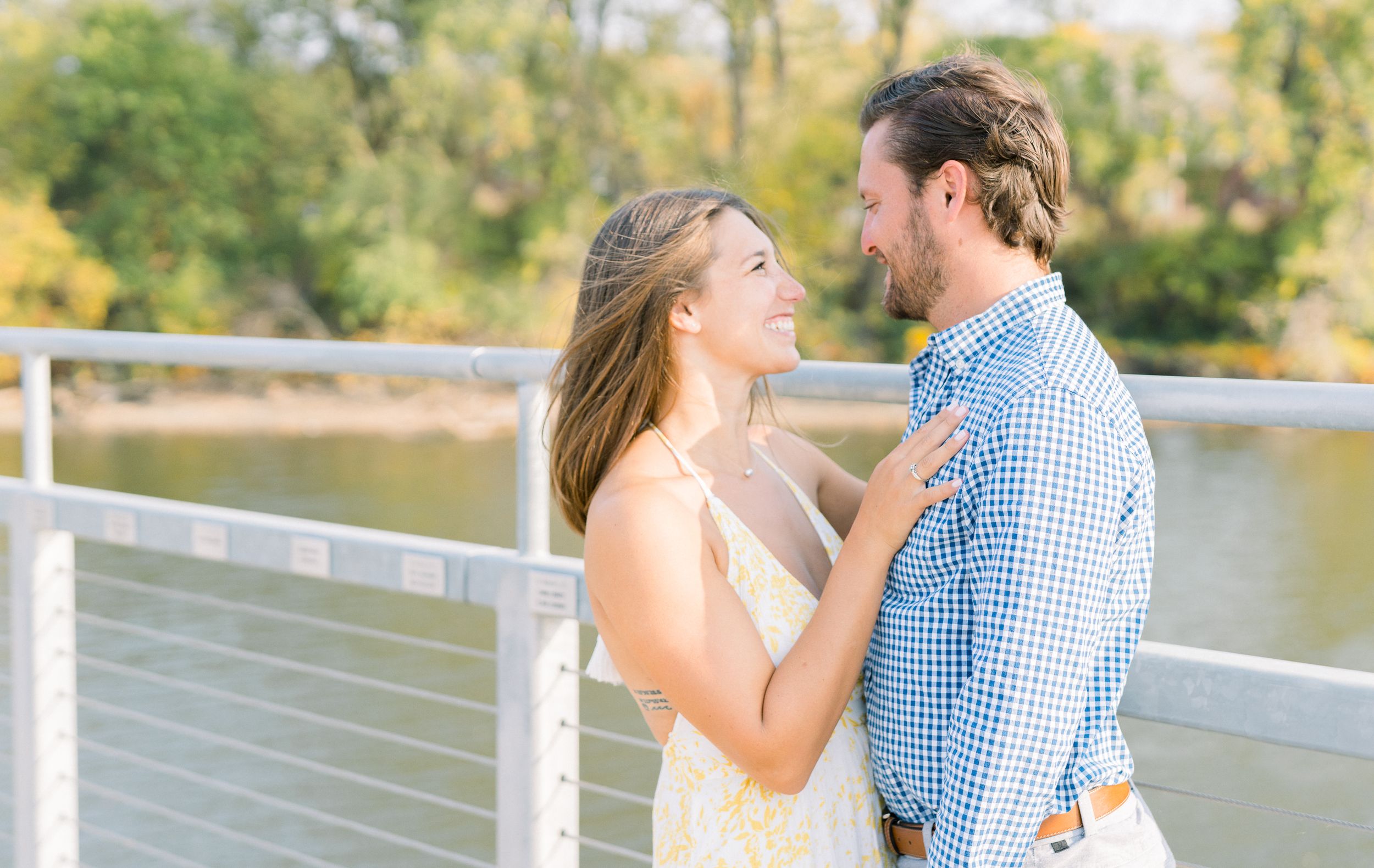 Des Moines Engagement photos at Grays Lake in downtown Des Moines, Iowa with light and airy photographer Nicole Laing