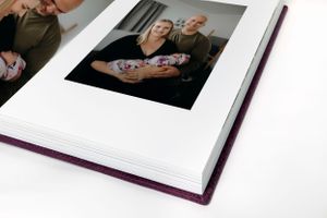 flush mount family photo album with family newborn photos inside
