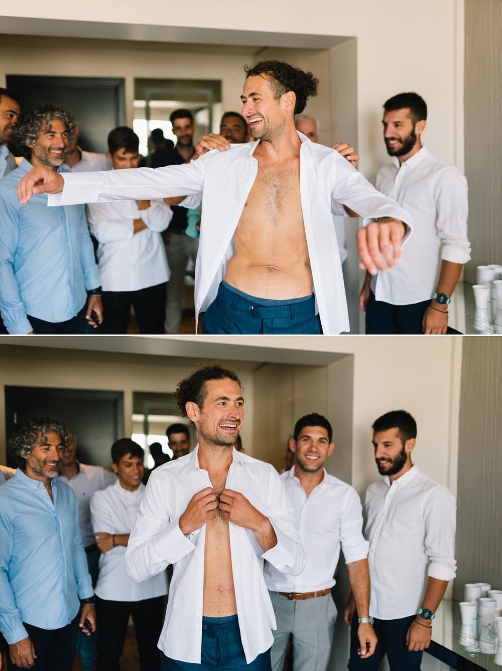 Groomsmen laughing and having fun while getting dressed in white shirts before the wedding.
