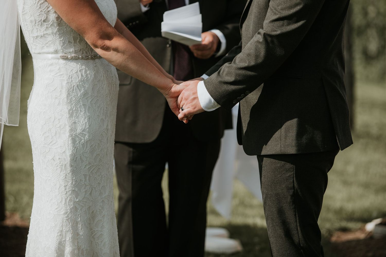 bride and groom holding hands