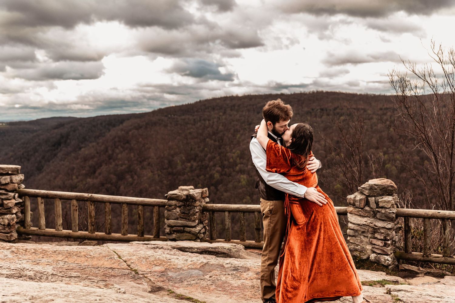 WV engaged couple embrace at Coopers Rock State Park