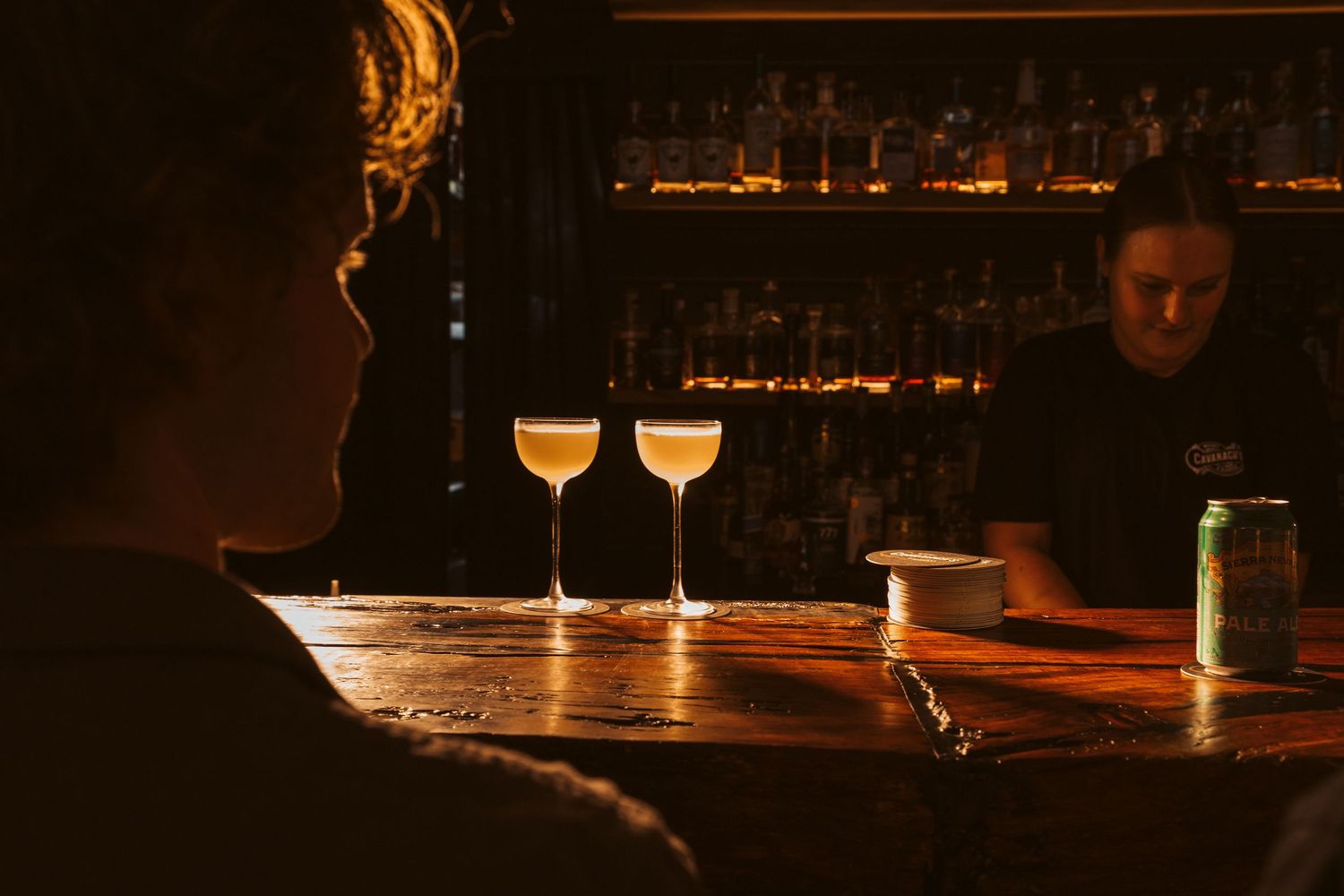 dark and moody image of cocktails sitting on a bar. Melbourne restaurant and food photography