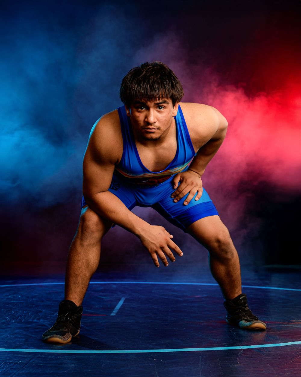 Arizona high school wrestler posing for media day portrait before Junior National Duals 2025, wearing team uniform, intense , smoke