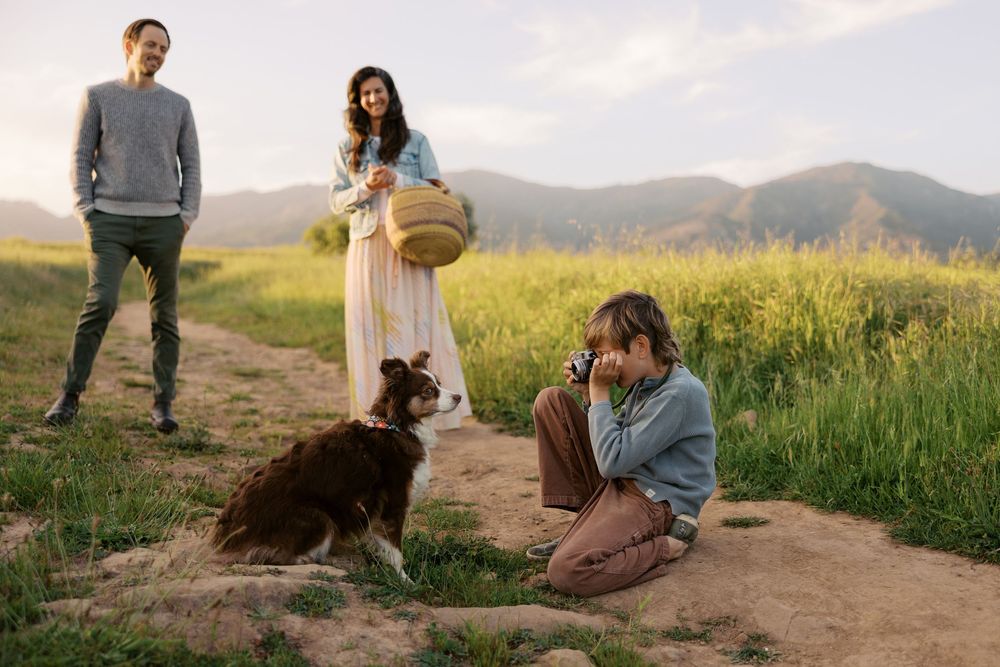 Storytelling family photography Santa Barbara. Young boy becomes photographer and takes photos of family dog.