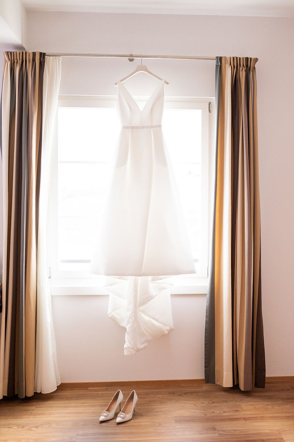 Bride getting ready at a hotel in Bad Ragaz, Switzerland - peaceful morning light, elegant details, and joyful anticipation with her friends