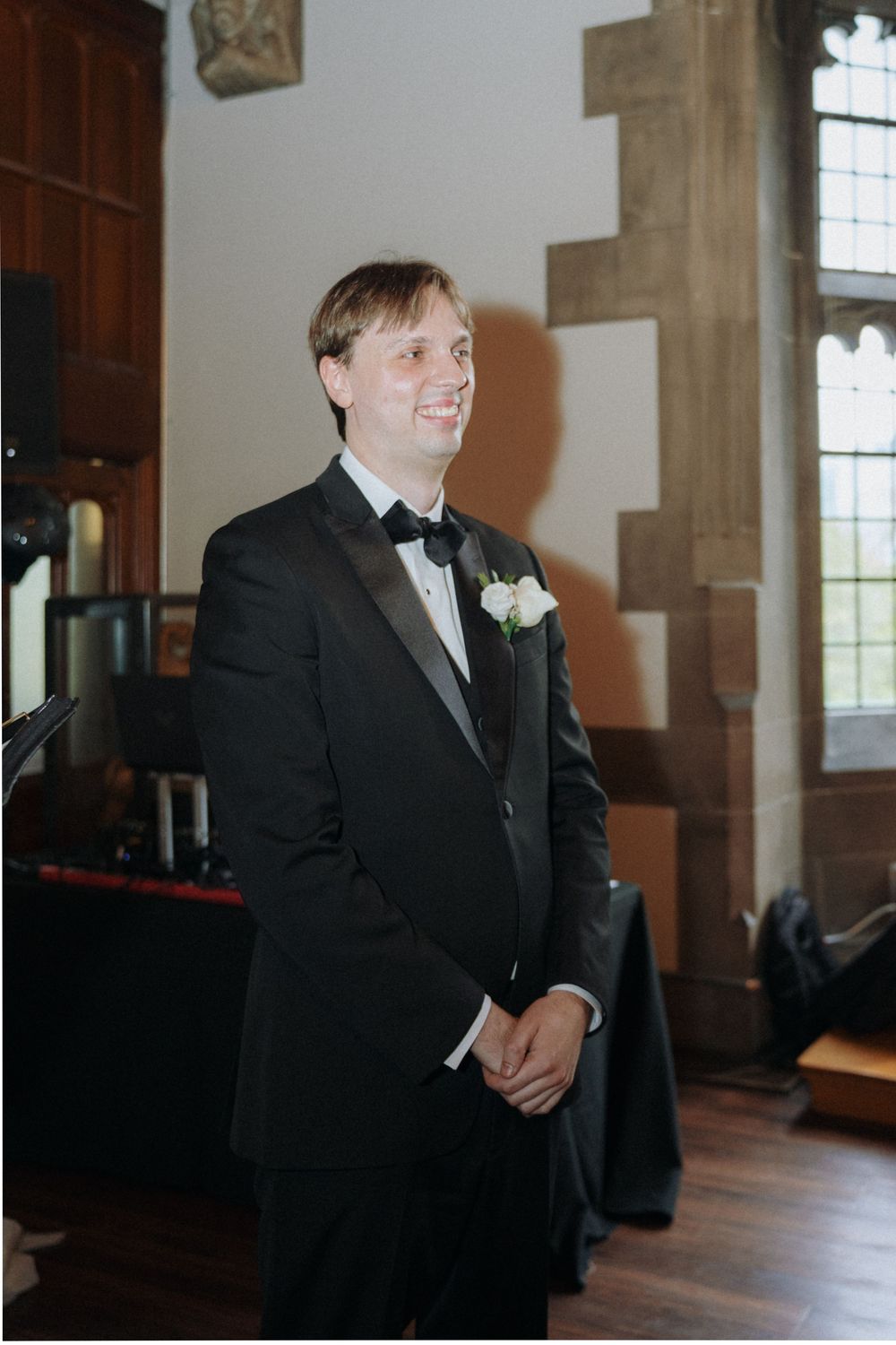 Wedding ceremony preparations inside an ornate stone church interior.