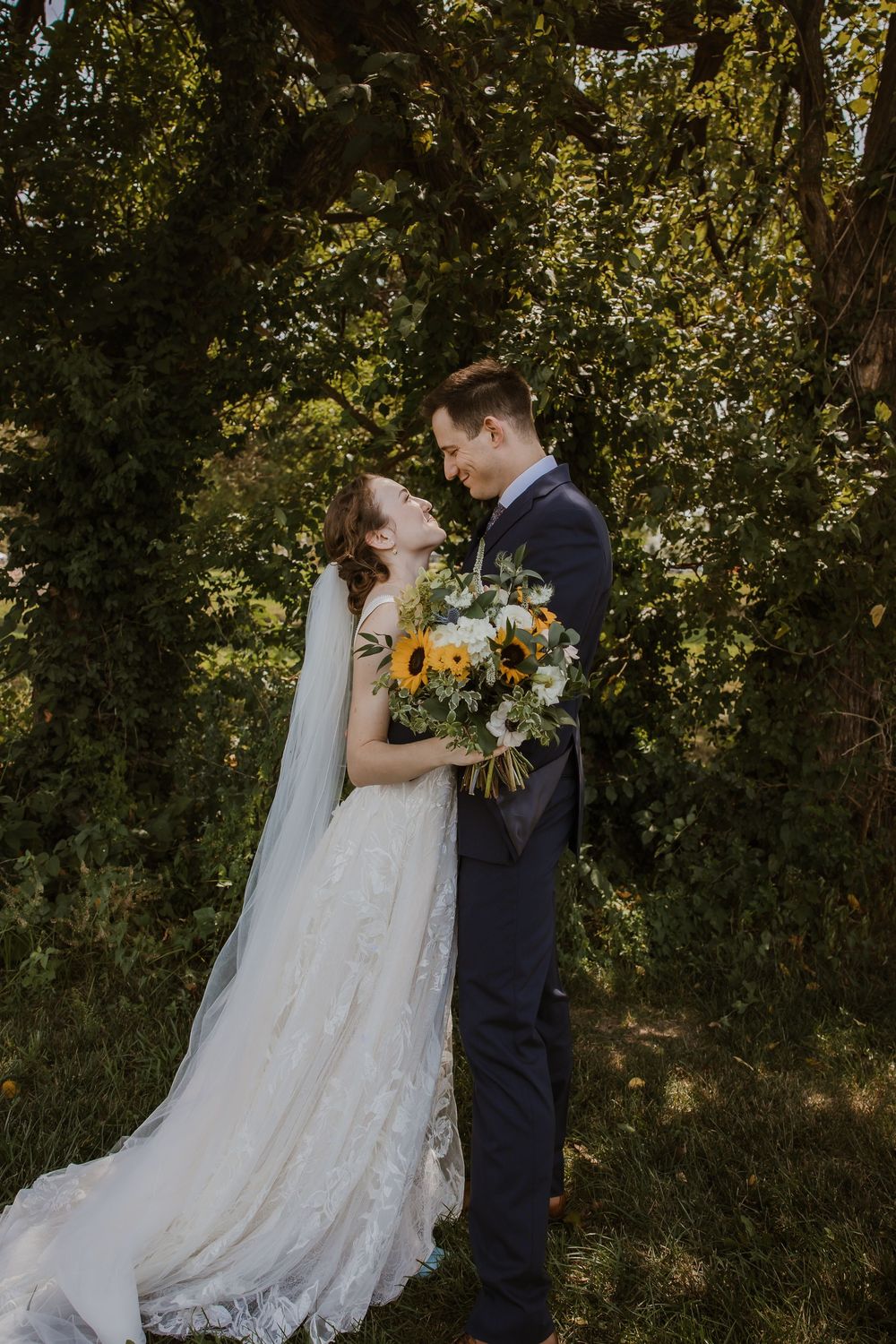 Romantic bride and groom portraits at Meadowbrook Park in Prairie Village Kansas captured by Poemas Photo + Video on a summer wedding day.