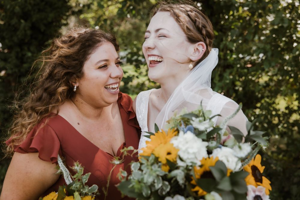 Candid bridal party moment with bridesmaid at Meadowbrook Park, captured by Prairie Village wedding photographer.