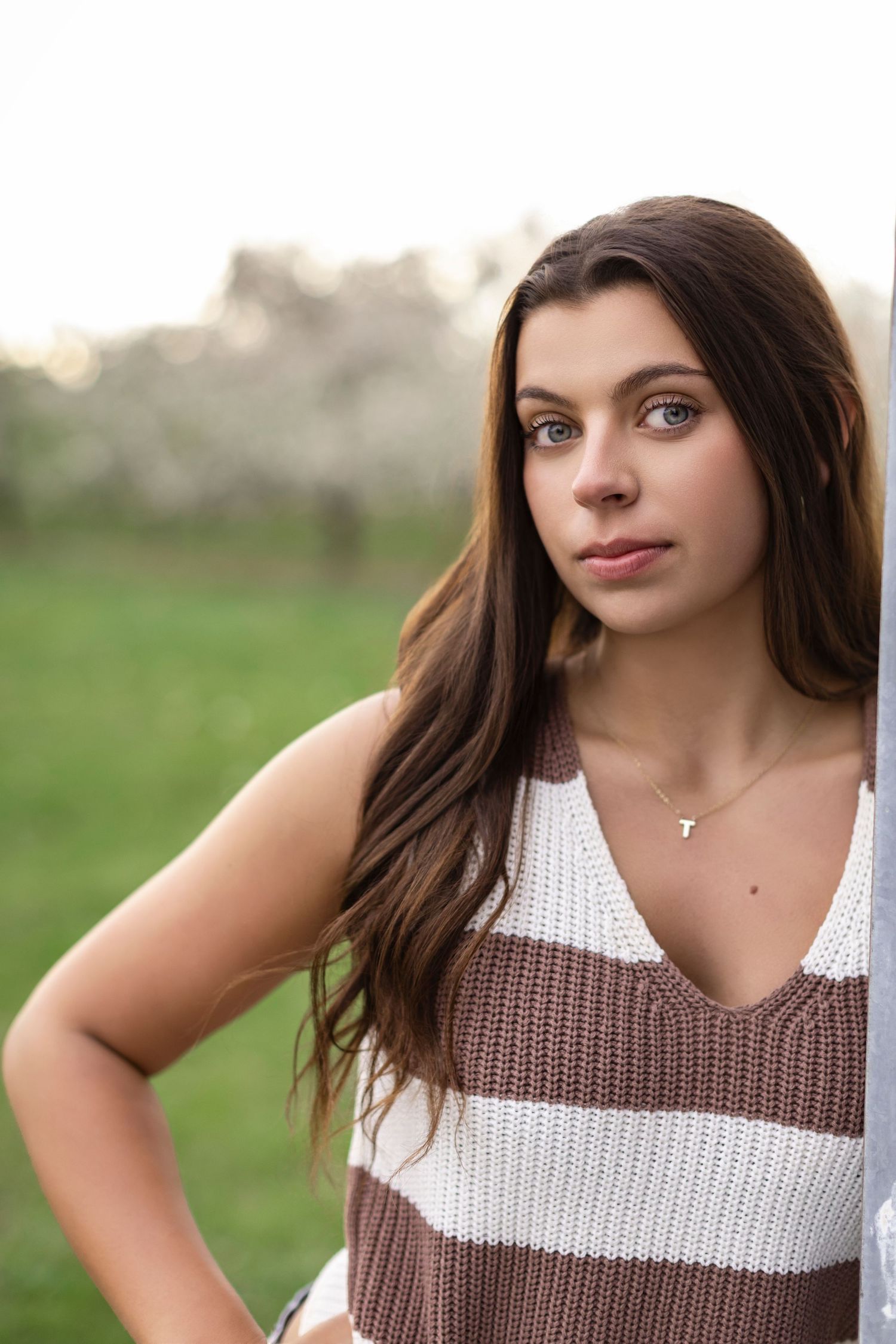 Orchard senior photoshoot highlighting spring in Van Buren and Allegan counties, Michigan
