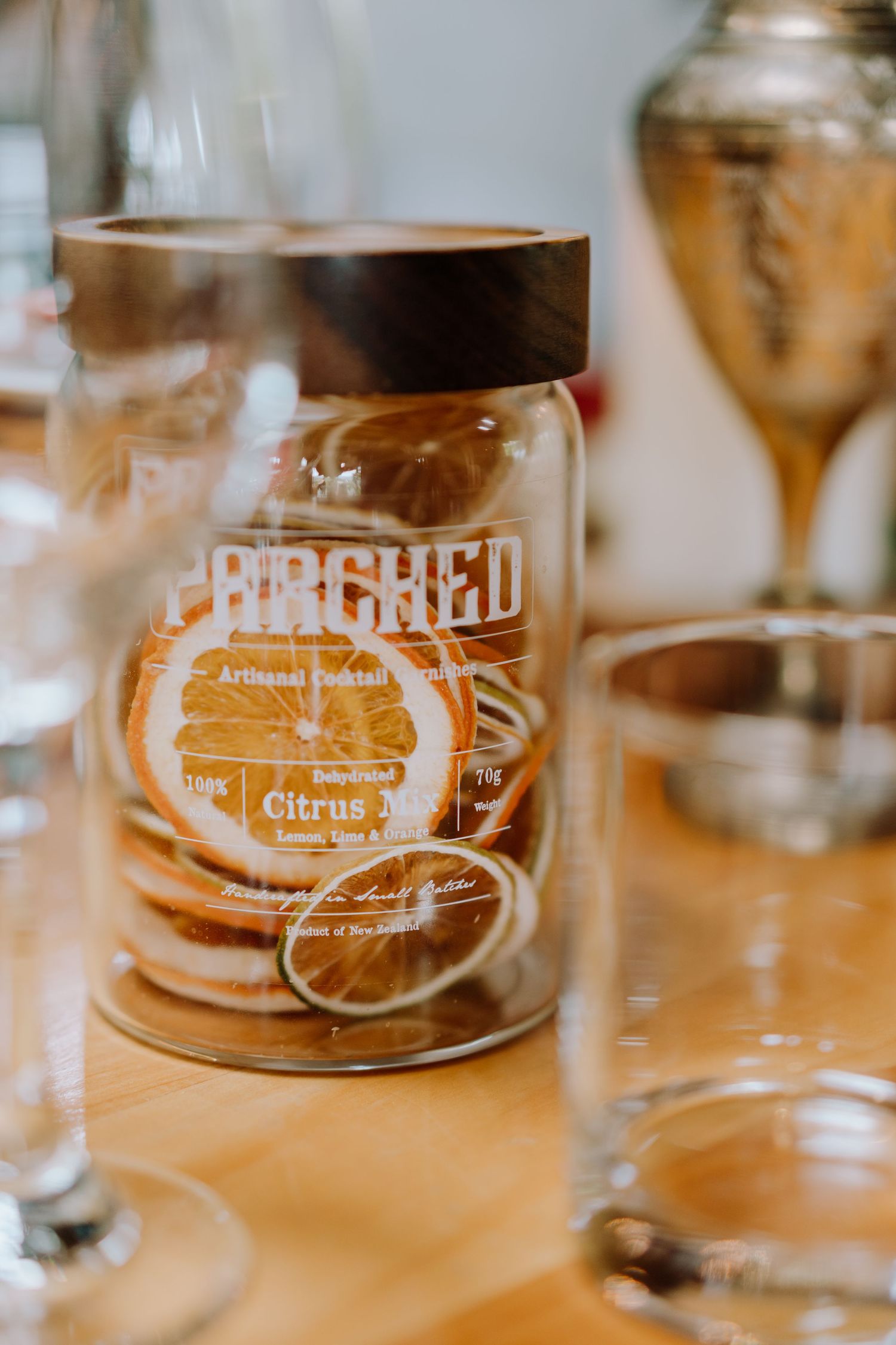 Glass jar with dried citrus with warm lighting.
