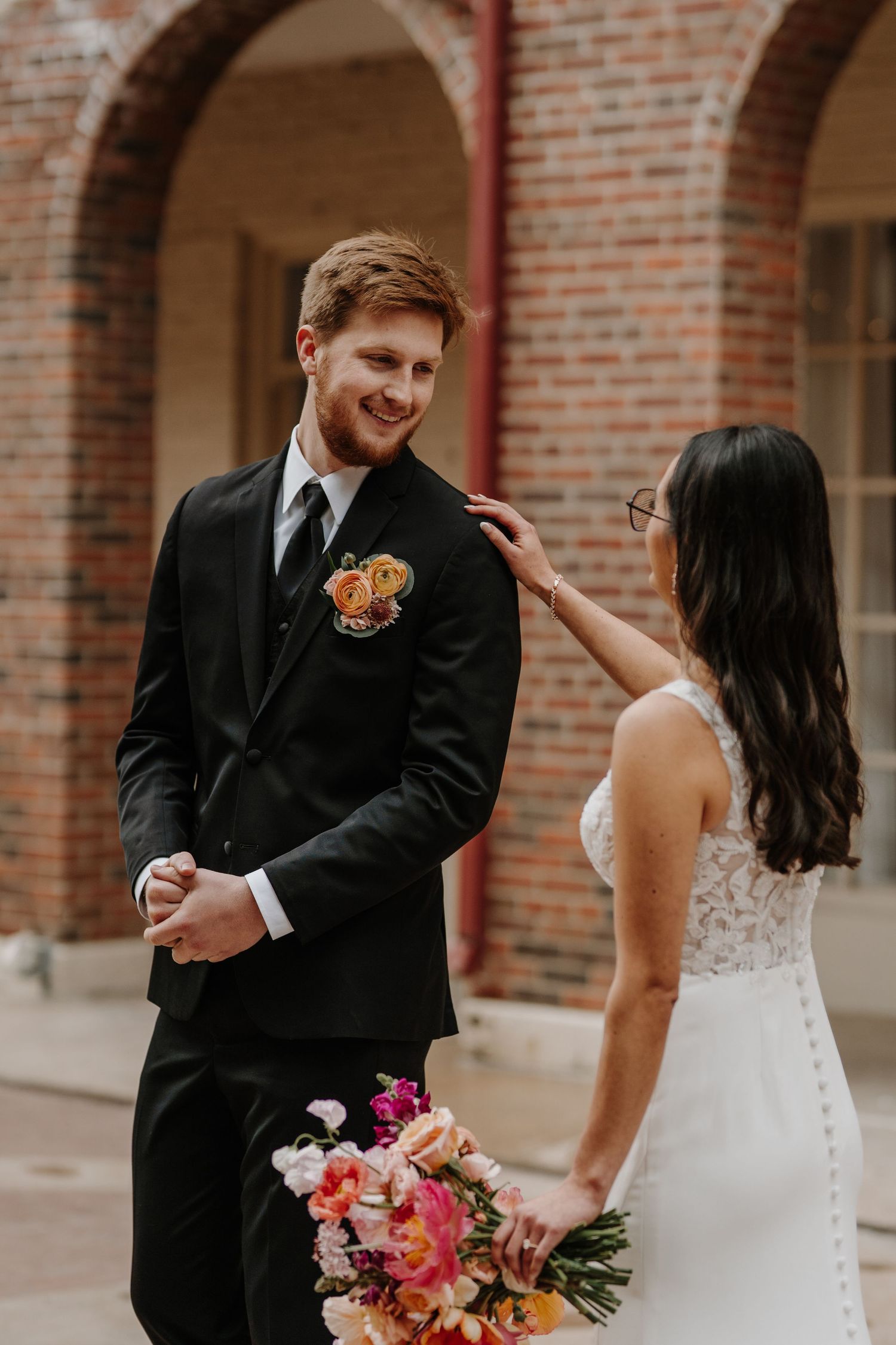 A bride and groom share a first look