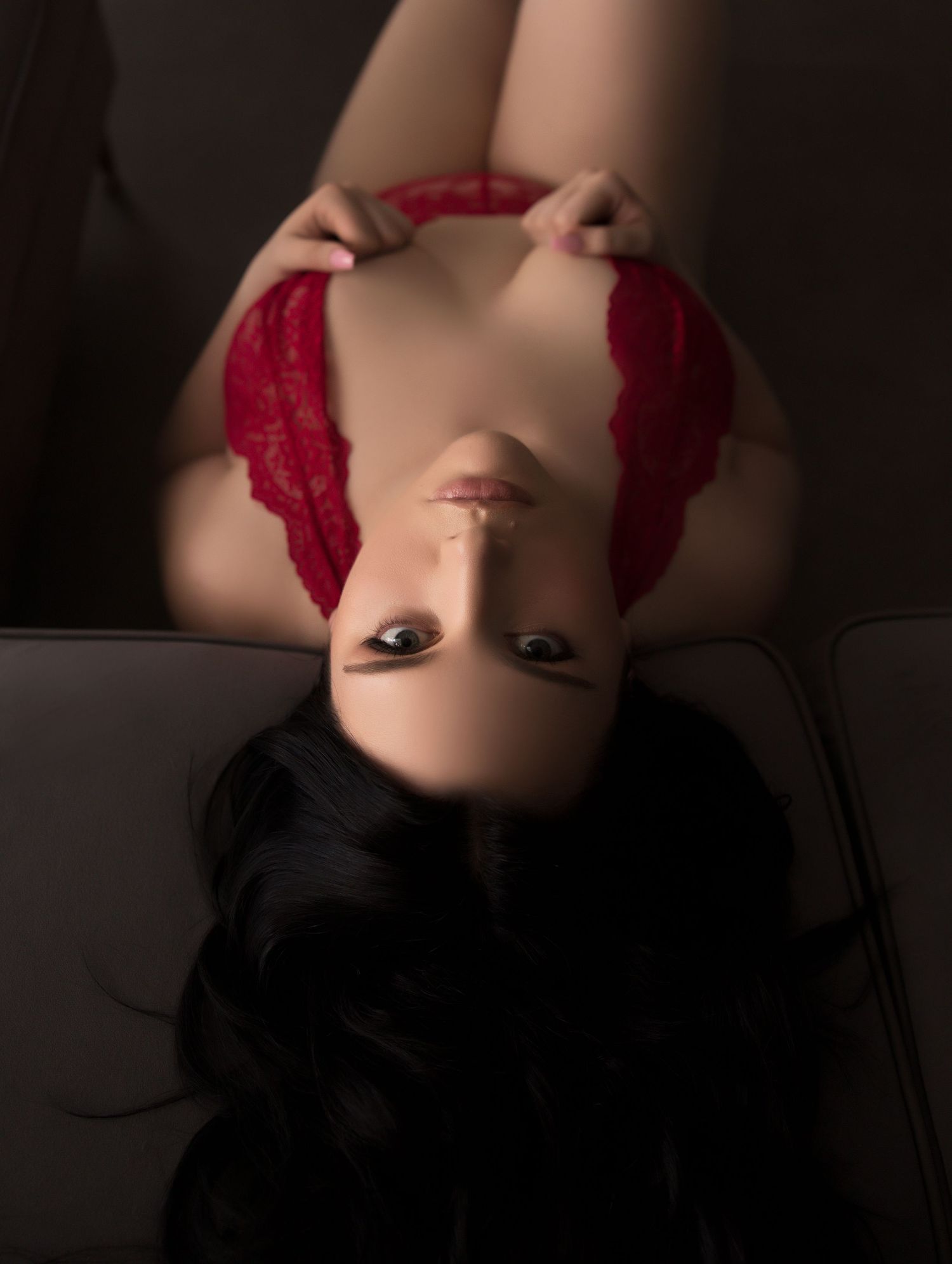 A woman posing for a boudoir photo