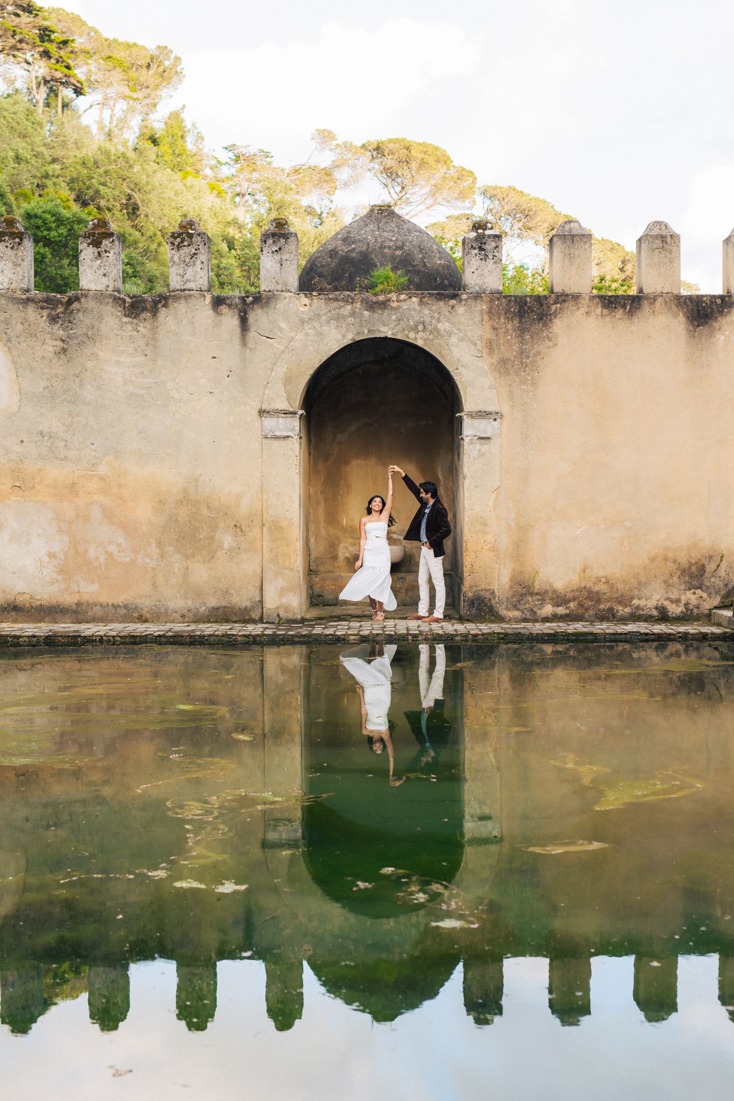 Romantic engagement photo-shoot in Sintra, Portugal, with an Indian couple exploring Penha Longa. By a destination wedding Photographer