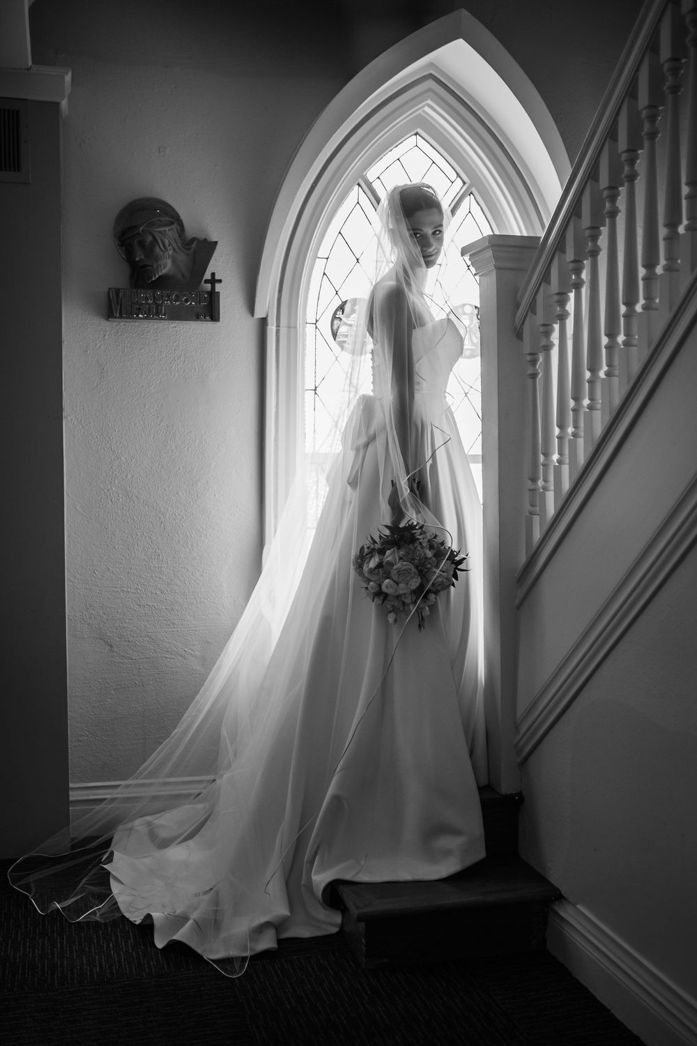 Ethereal black and white photograph sequence showing ghostly figure beside gothic window and staircase.