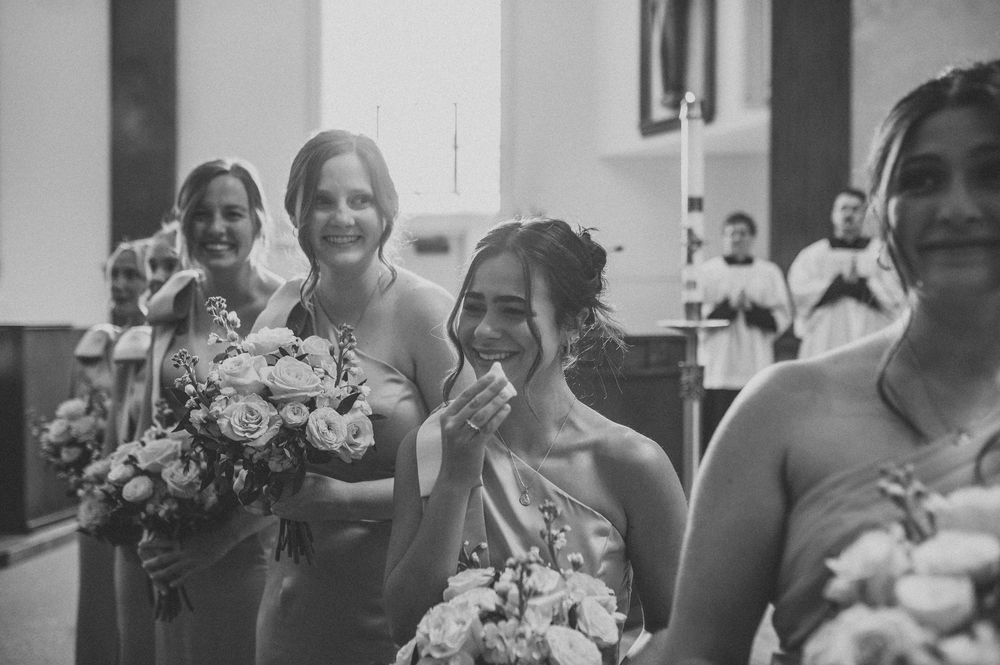 A joyful wedding celebration montage showing candid moments with the wedding party and guests at the reception.