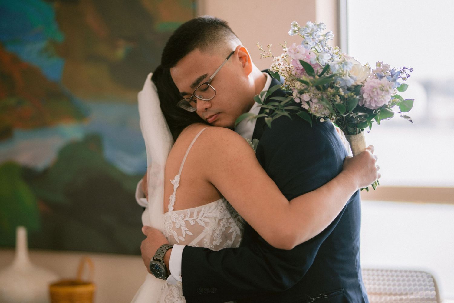 Tender embrace shared during an emotional wedding moment.