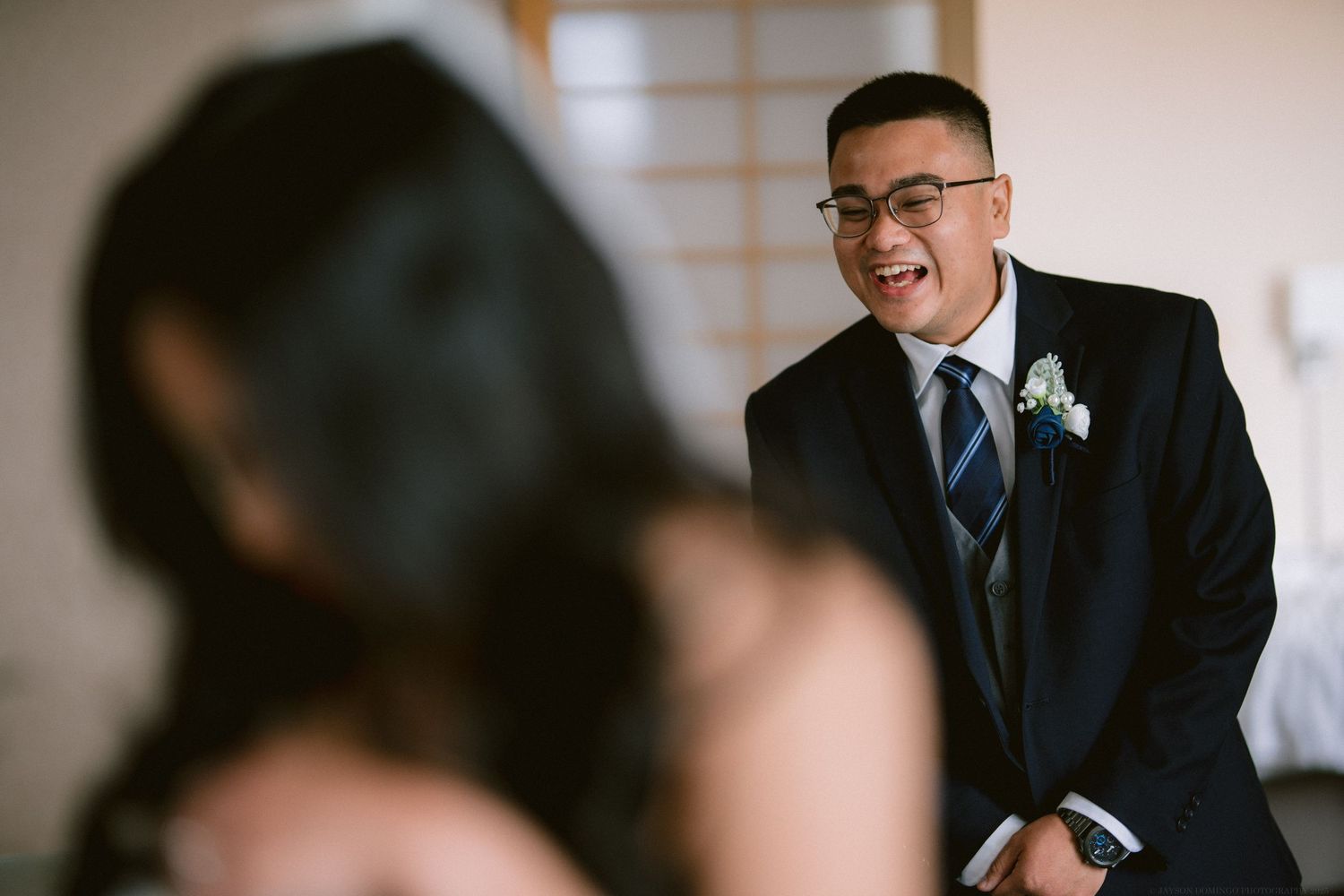 Candid moment captured during a formal event showing joy and laughter.