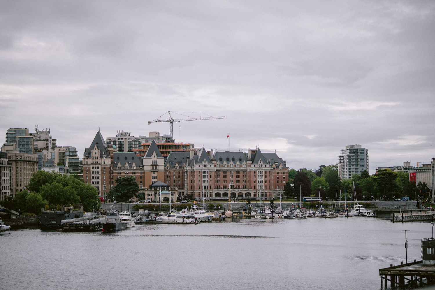Harbor view of Victoria with boats and historic buildings along waterfront.