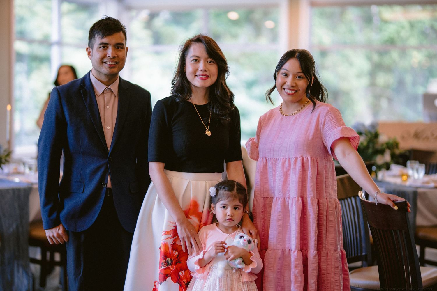 Group portrait of elegantly dressed family members at a formal gathering.