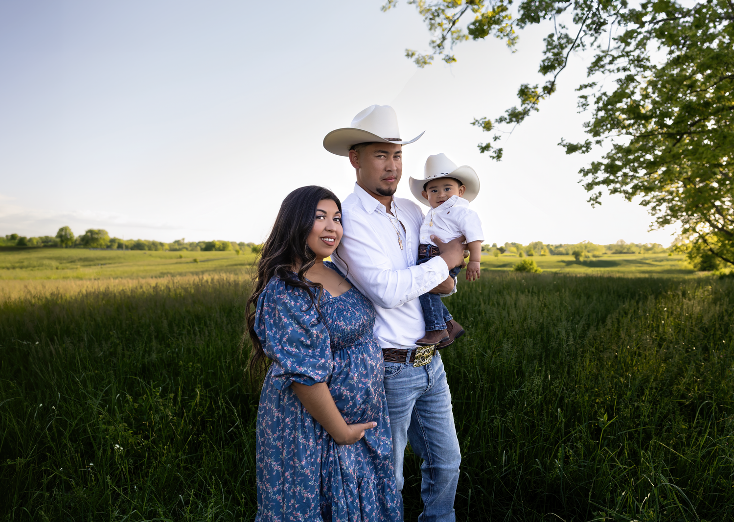 A golden hour maternity session in the Kentucky fields capturing a growing family’s love as they await their second baby boy, photographed b