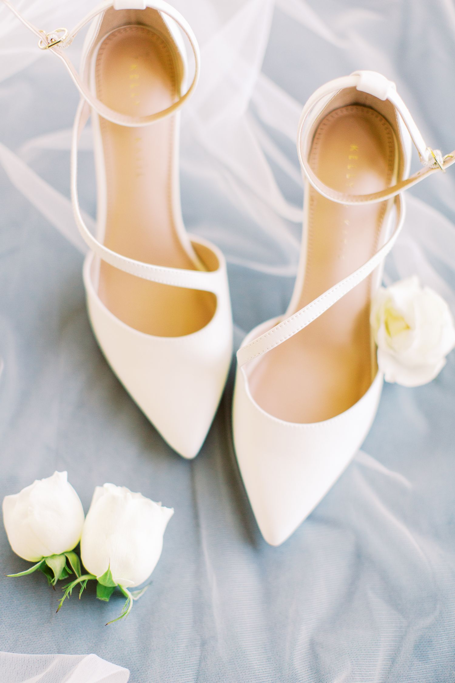 bride's shoes styled with veil and flowers on wedding day in savannah, ga