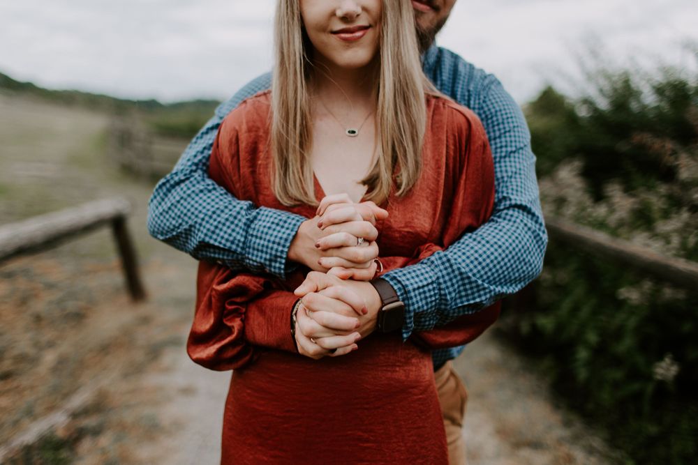 couple holding hands at steeplechase in Nashville