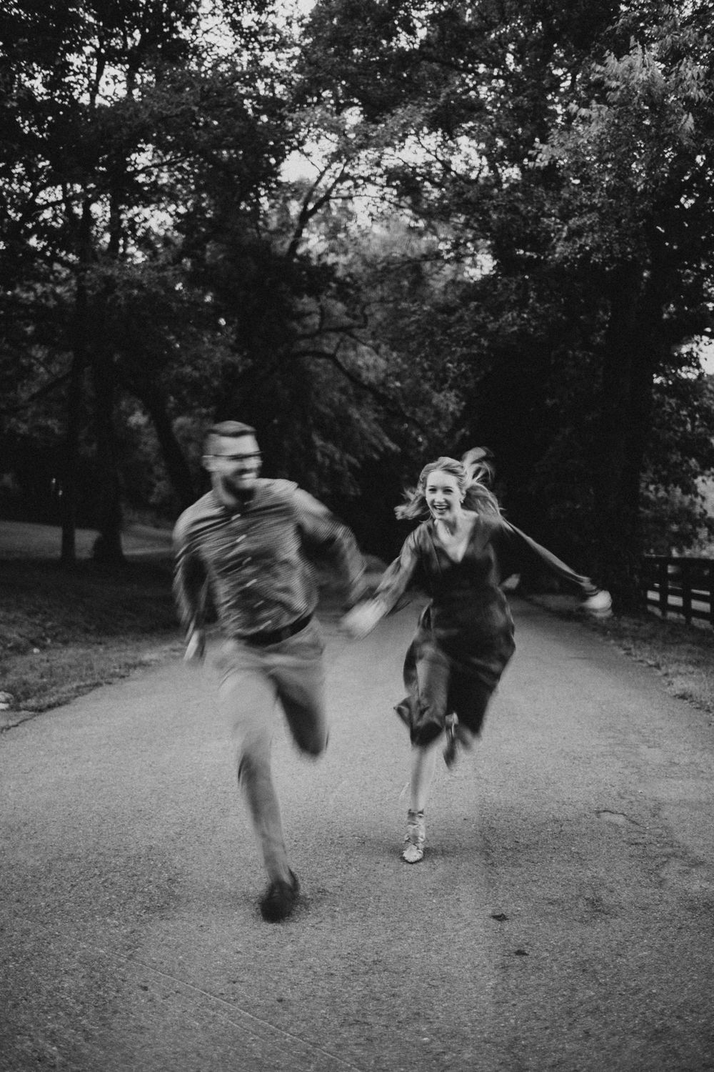 couple running down a road in Nashville Tennessee