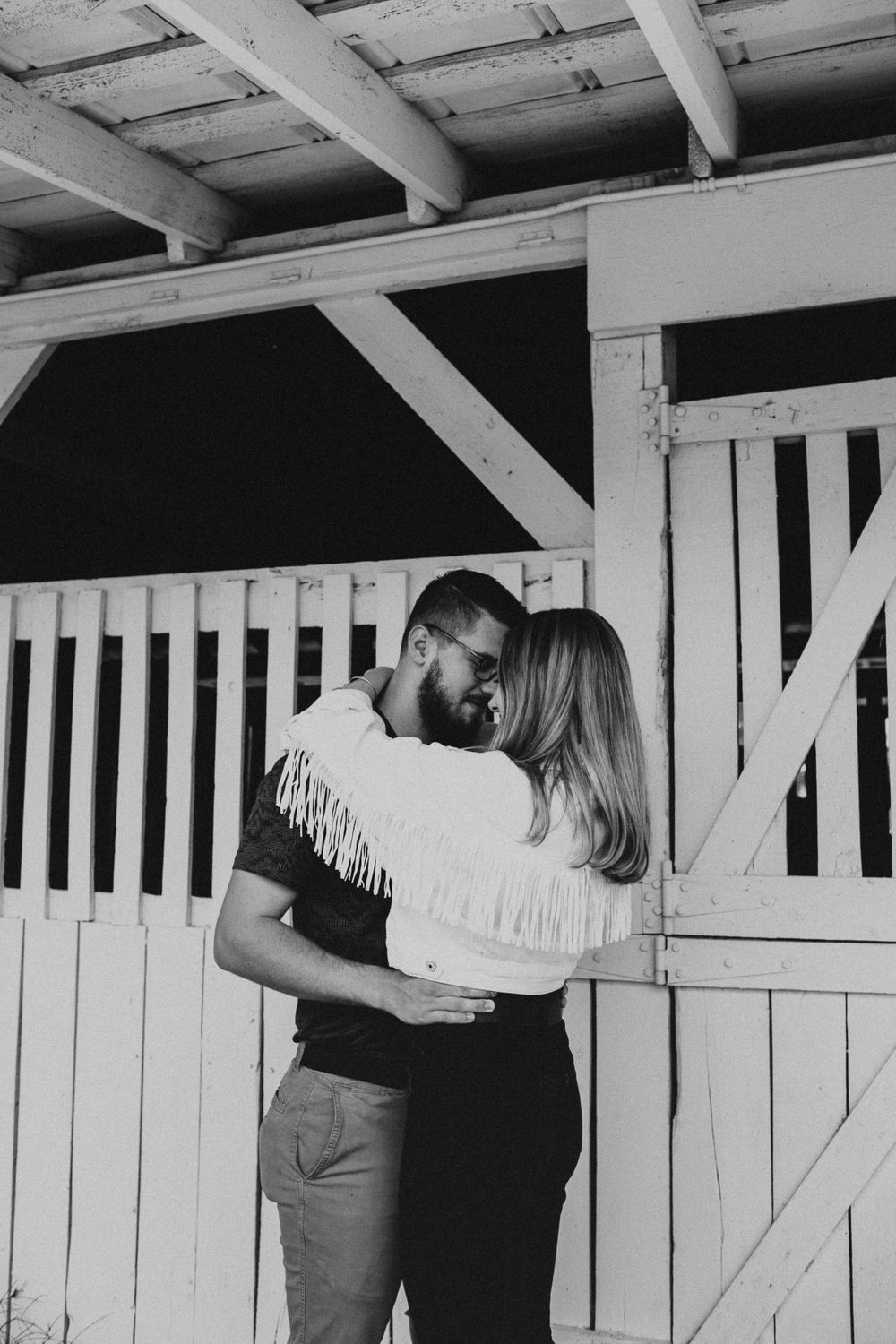 couple slow dancing next to barn in middle Tennessee