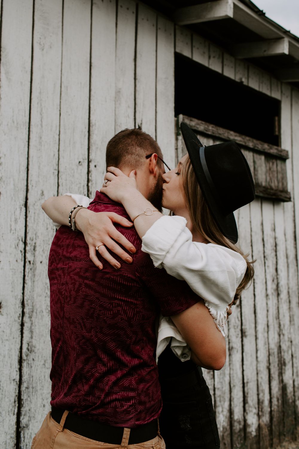 woman kisses her partner on the cheek at Harlinsdale Farm in middle Tennessee