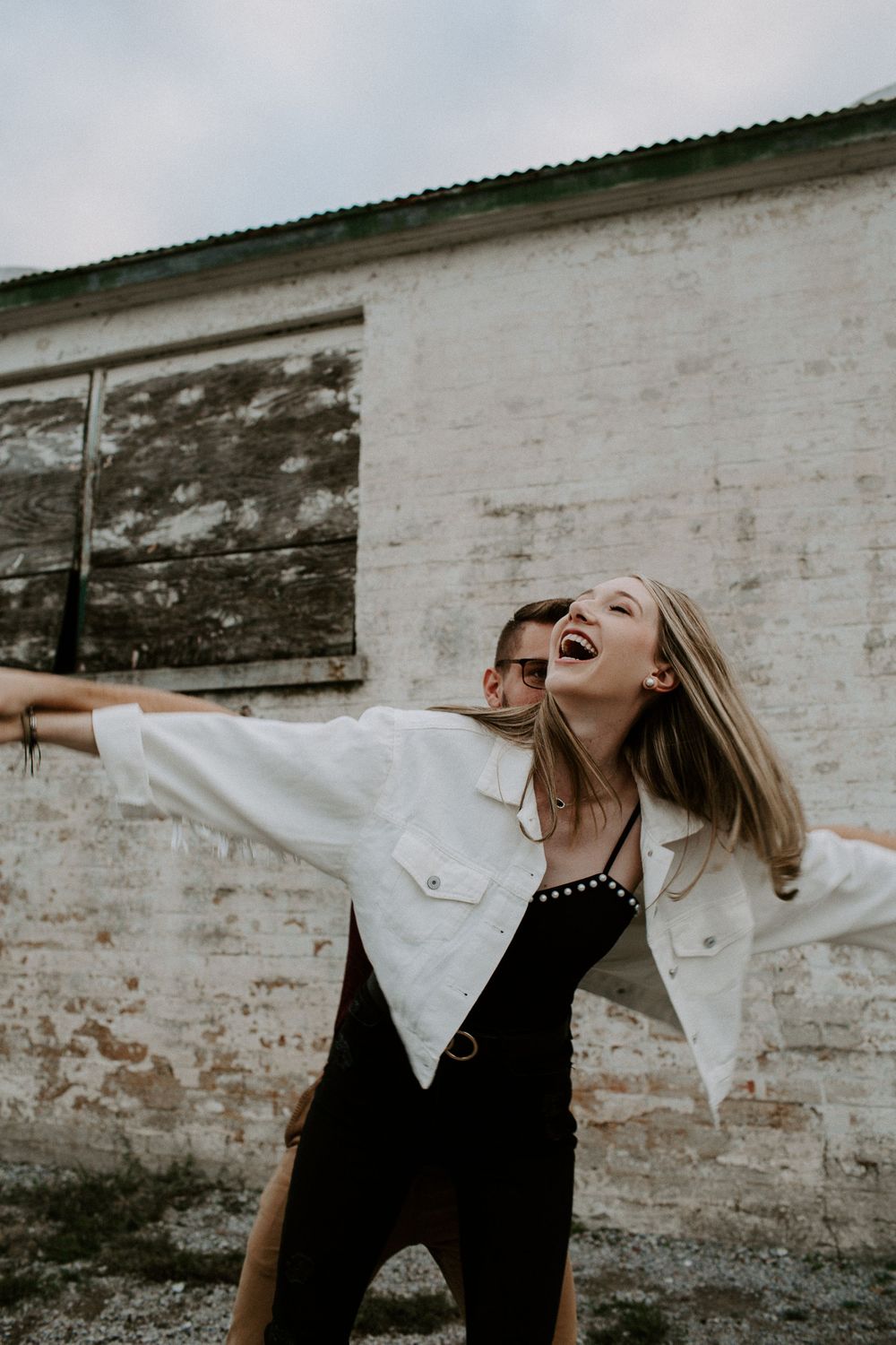 woman laughing during couples photo session in Nashville