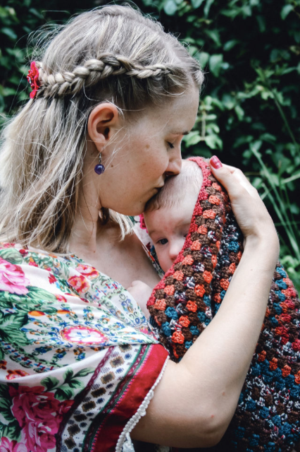 new parents holding baby cuddling sydney