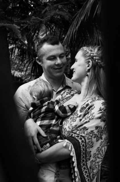 new parents holding baby cuddling sydney