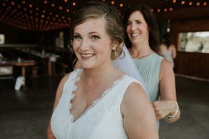 Bride and her mom fixing her veil