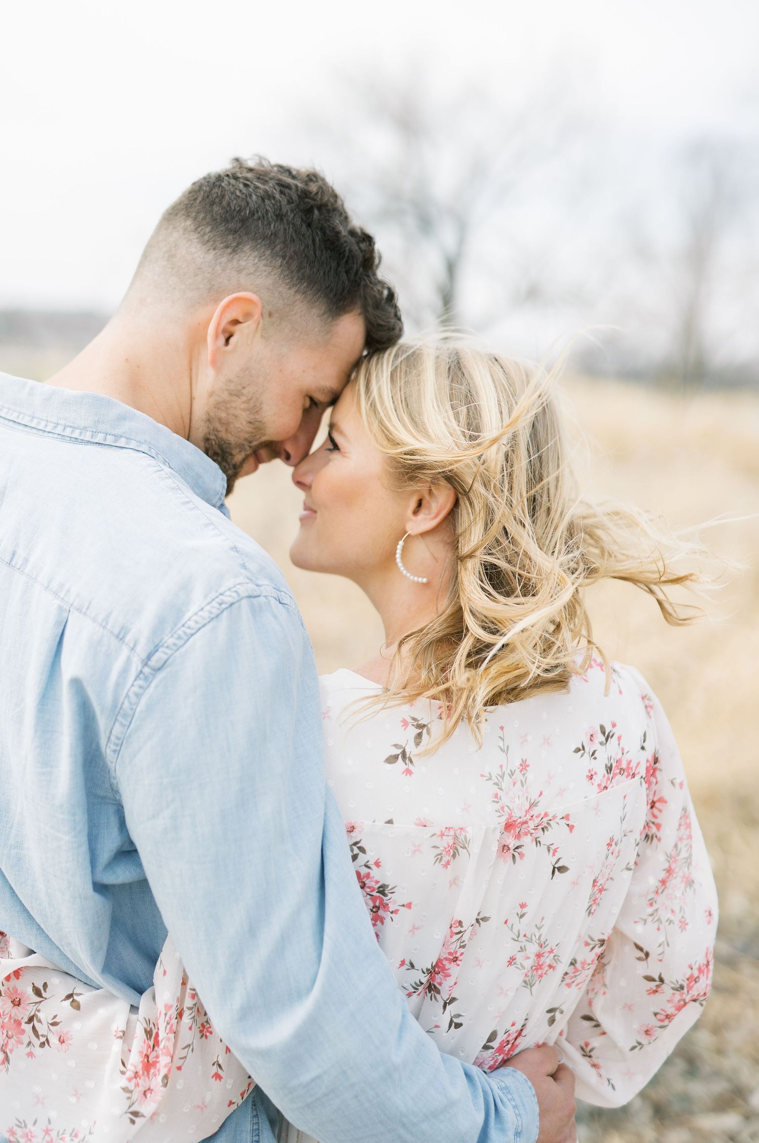 Light and airy film lakeside dock engagement session at Gray's Lake in Des Moines, Iowa