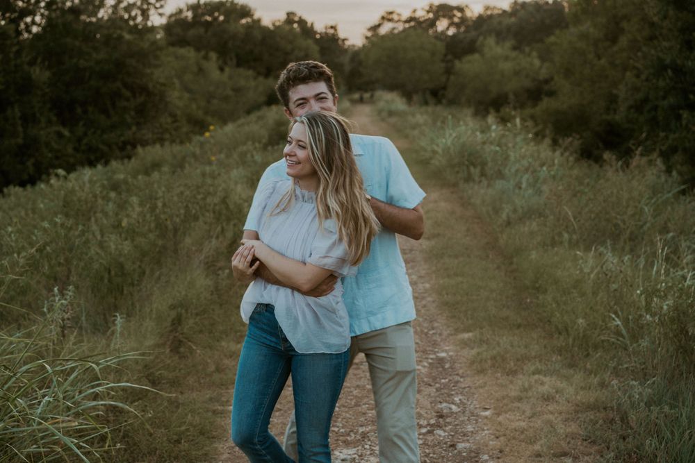 Couple dancing on a dirt road