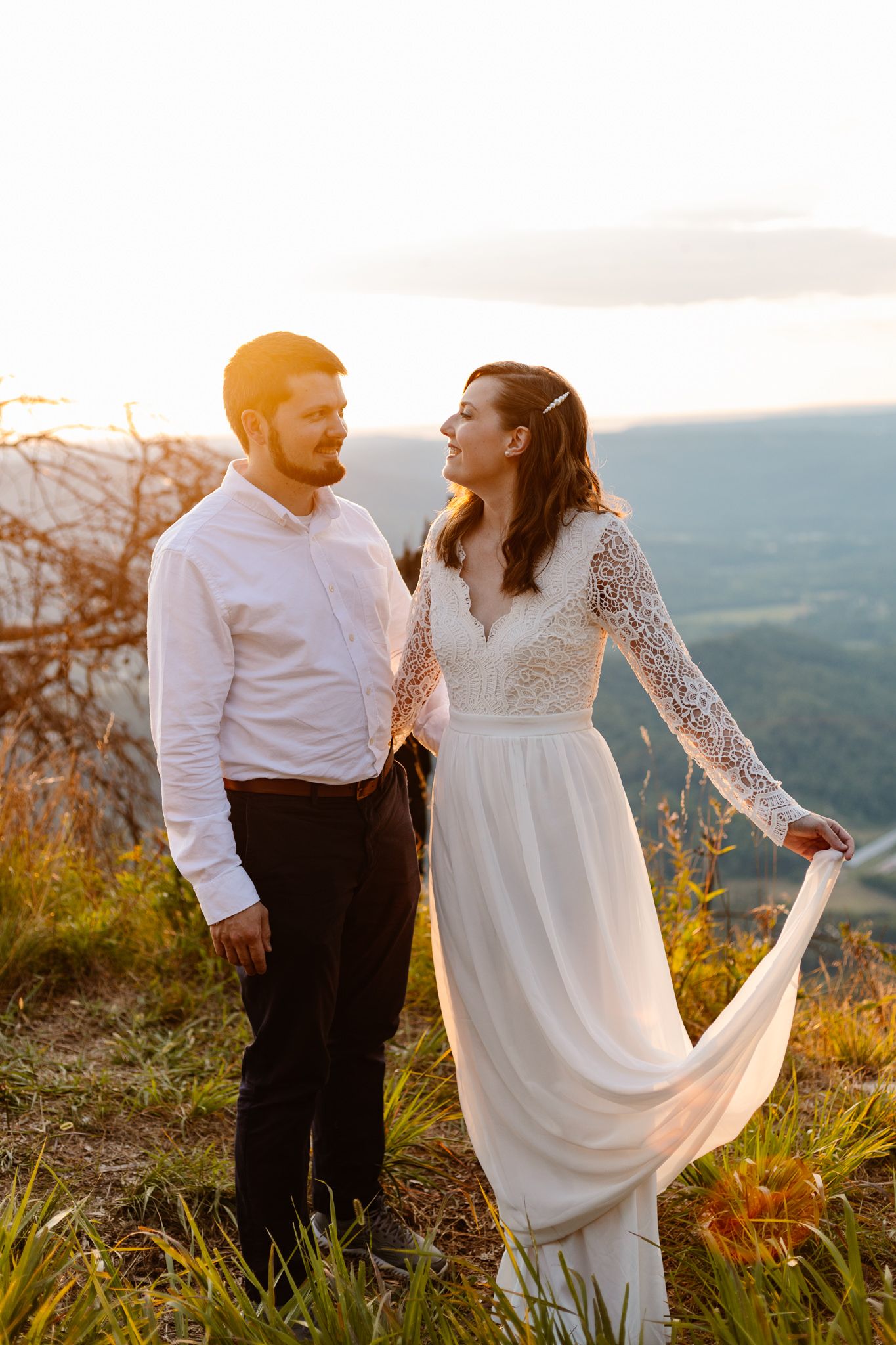 A couple having a vow renewal in Chattanooga smile for their vow renewal photographer.