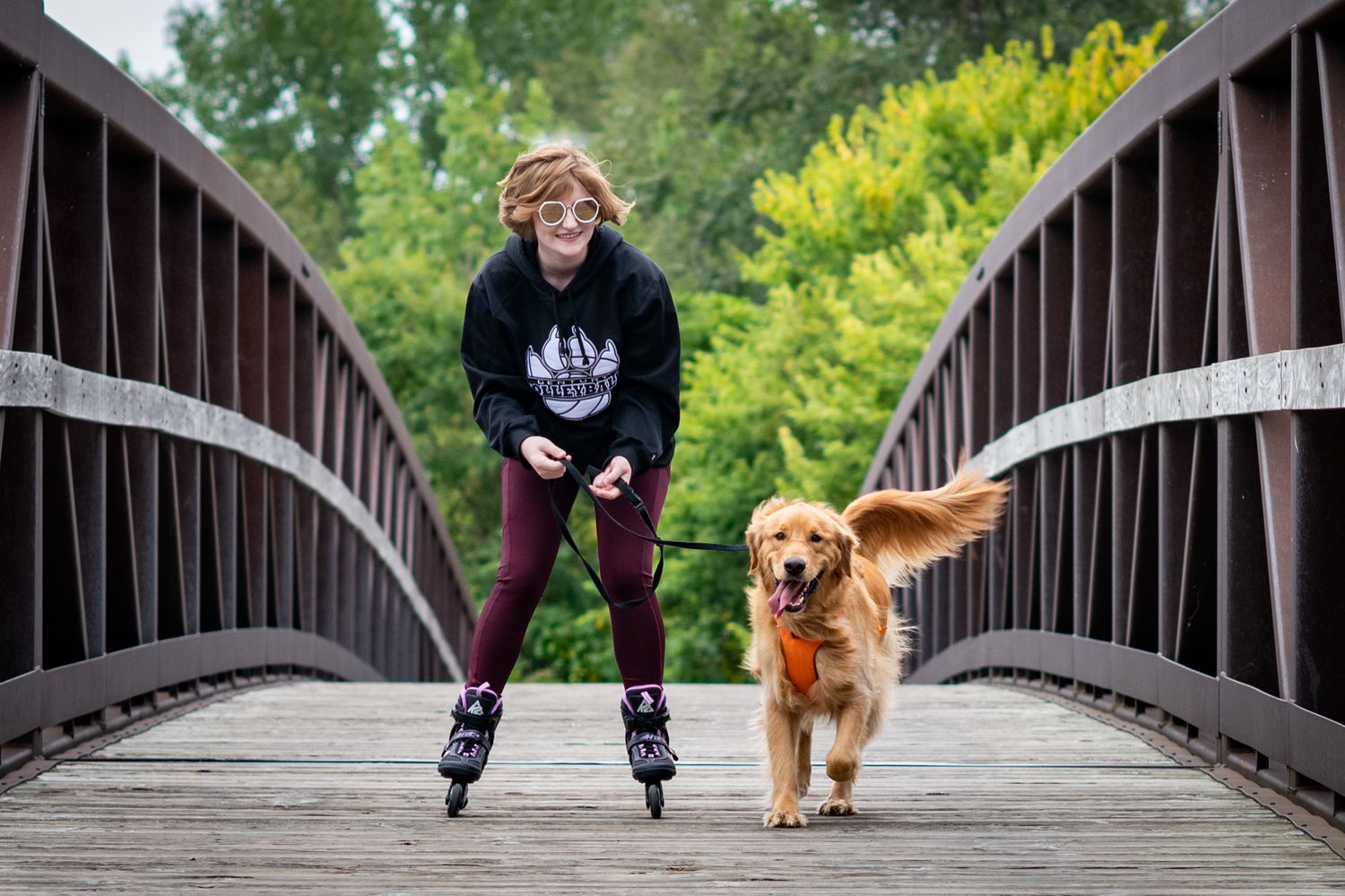 Senior Photo Rollerbladding with Golden Retriever
