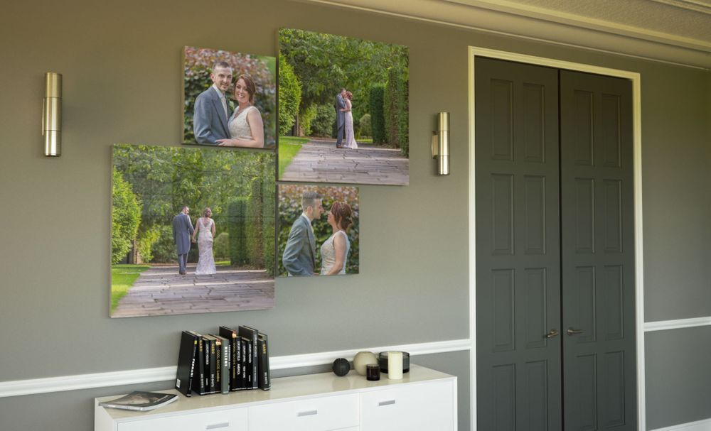 collection of metal prints wall mounted in a living room setting by graphistudio