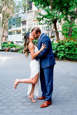 interracial couple kissing in Madison Square Park, NYC