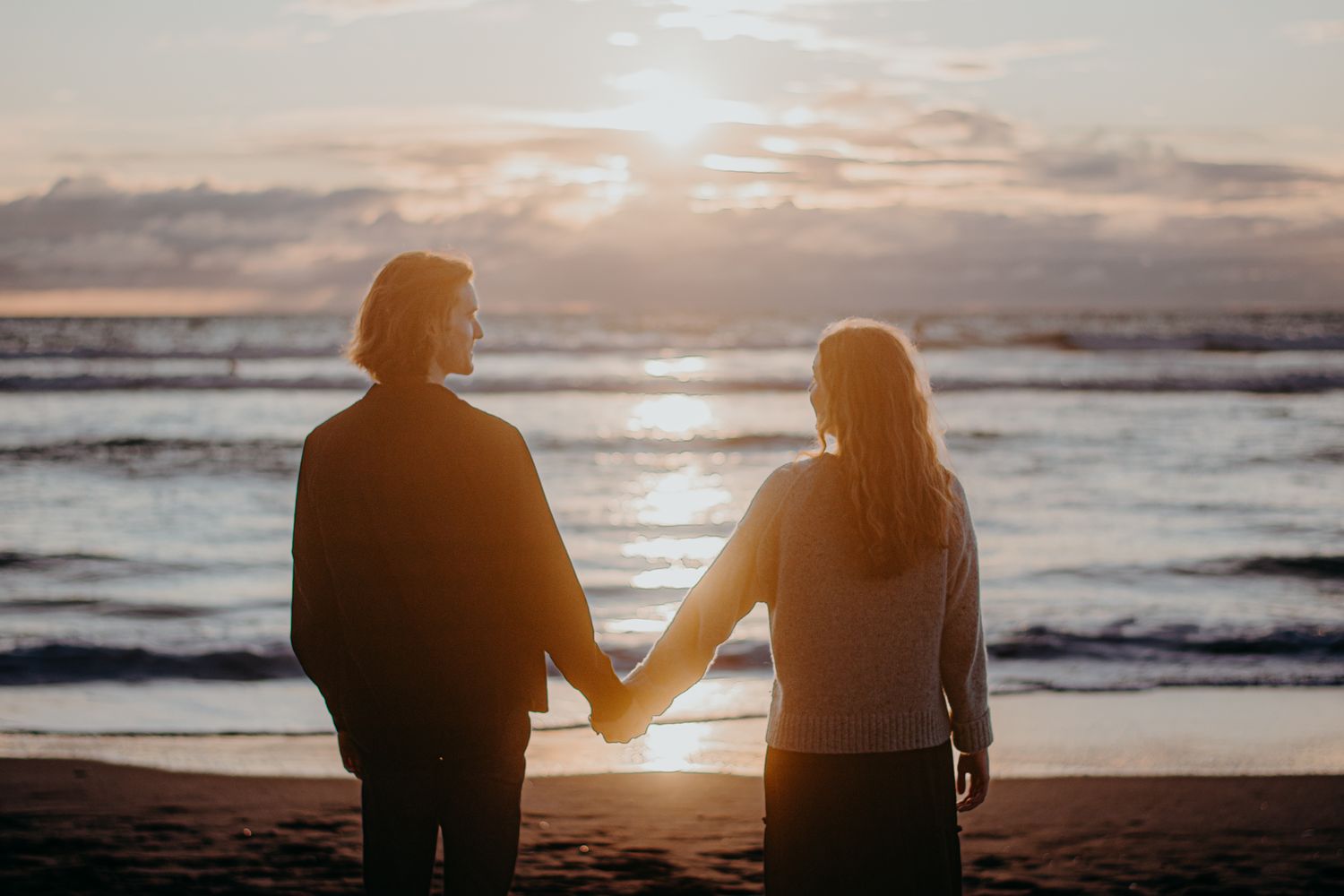 A couple in love for their engagement shoot in Piha with Apertured Media-Auckland Wedding and Elopement Photographer
