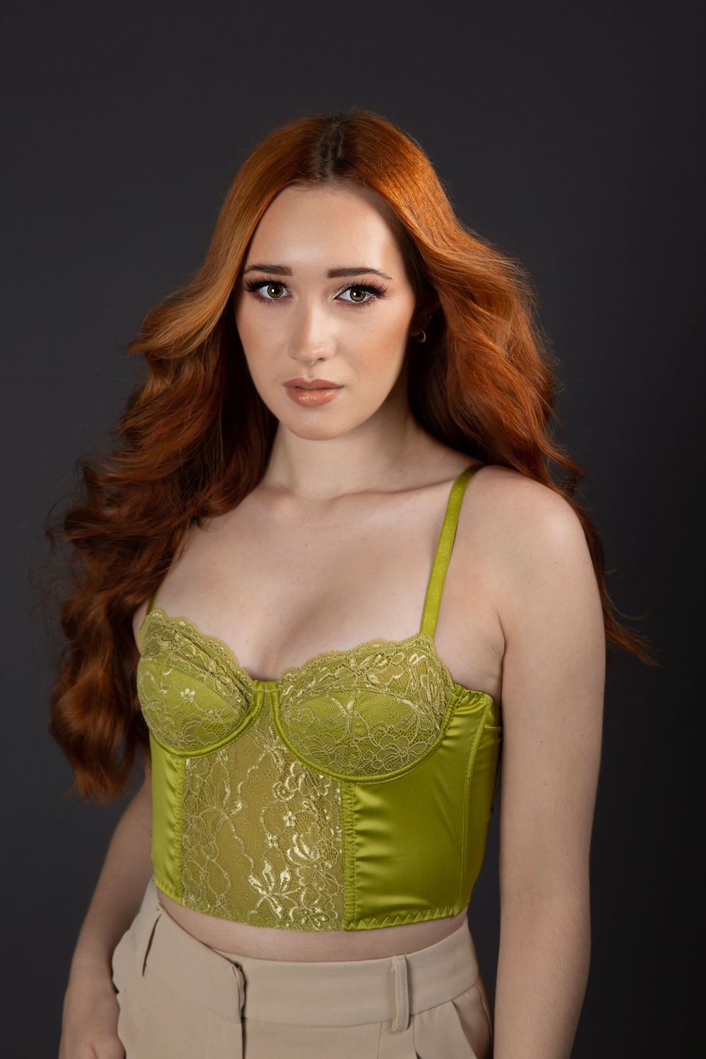 model wearing green corset