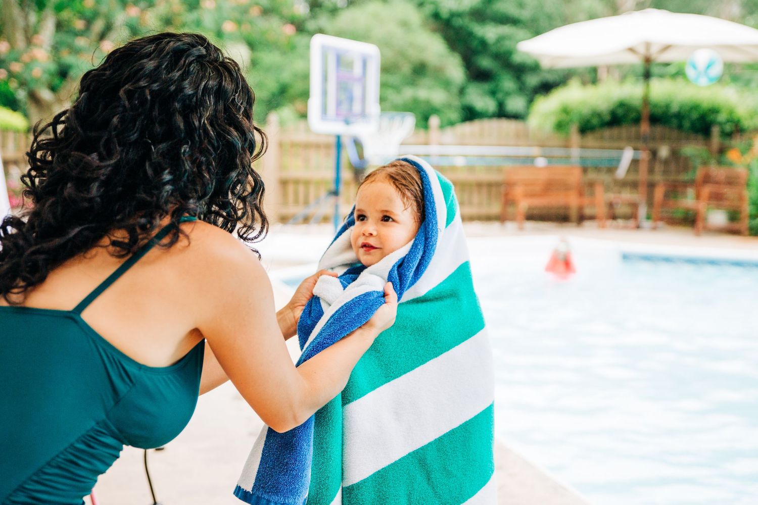 Mom drying off daughter by the pool in Charlotte, NC