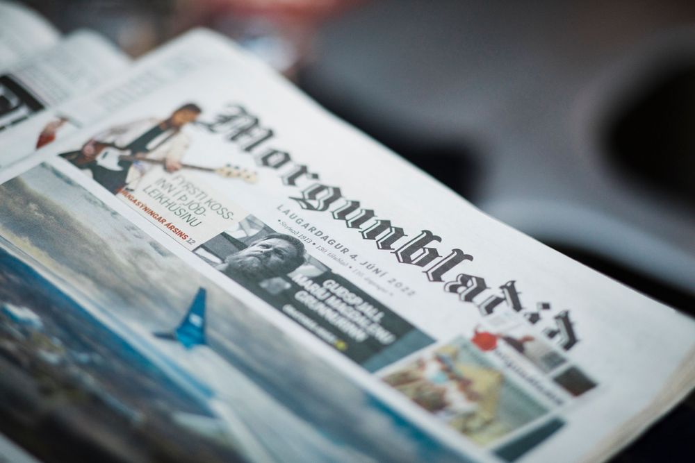 Close-up of a Morgenbladet newspaper lying on a dark surface.