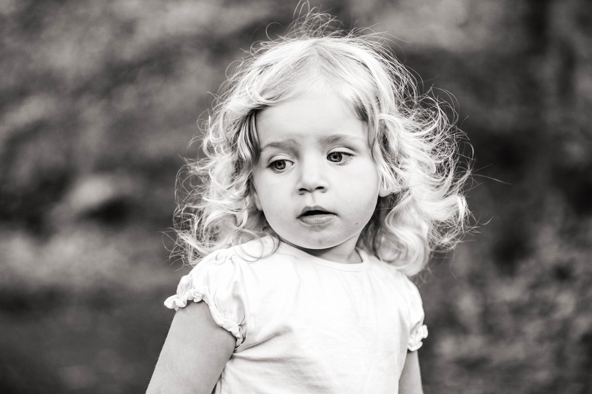 black and white portrait of little blonde haired toddler girl